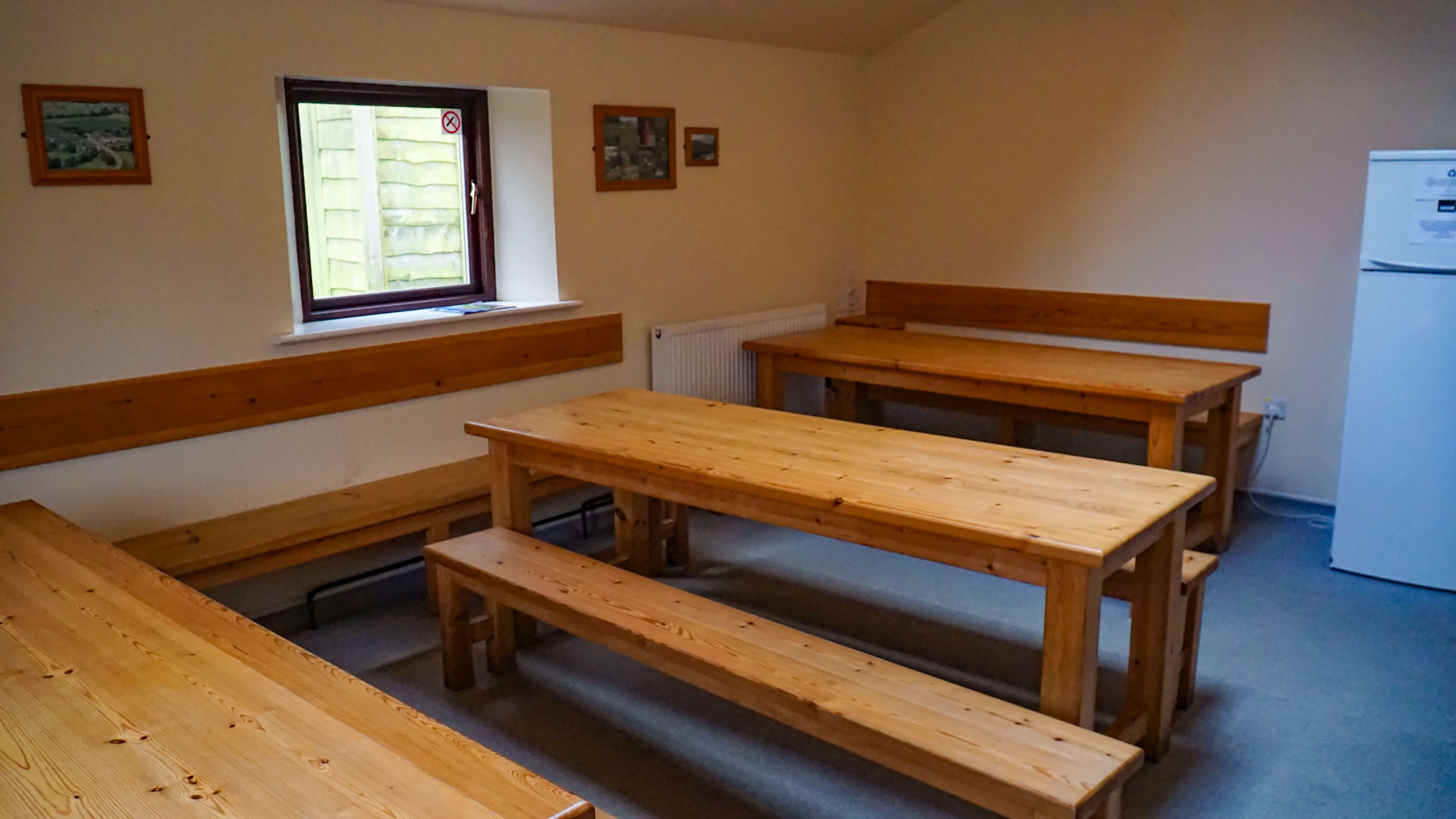 3 Peaks Bunkroom - dining tables and benches allow a large group to eat together