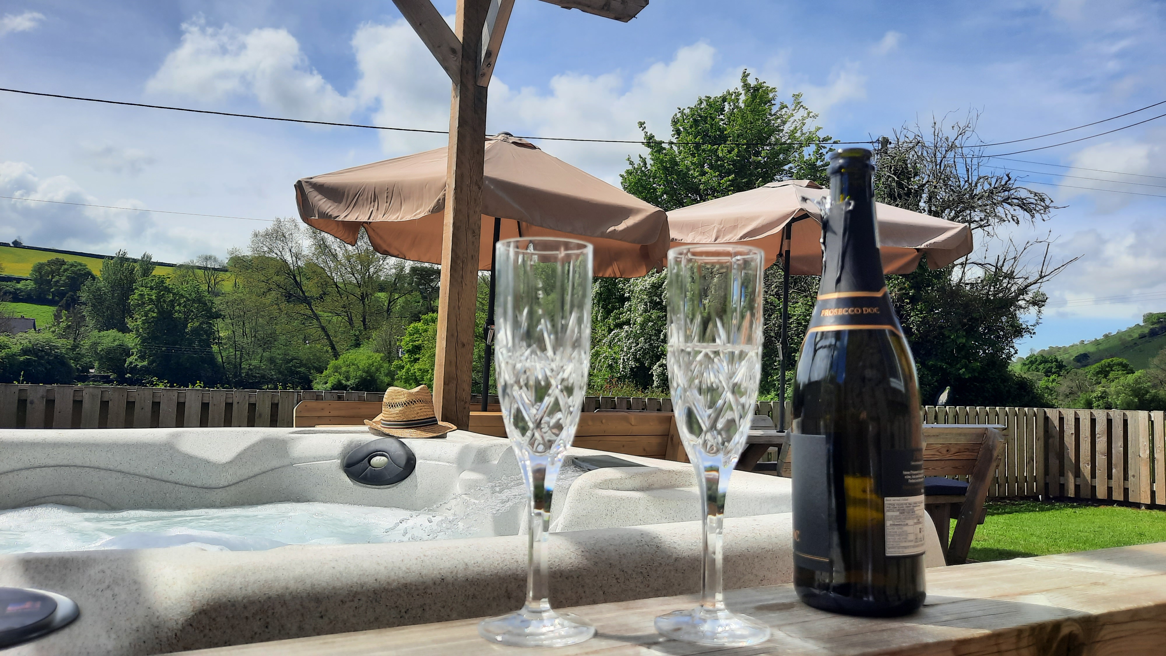 The Elms Devon - glass of fizz to celebrate in the hot tub