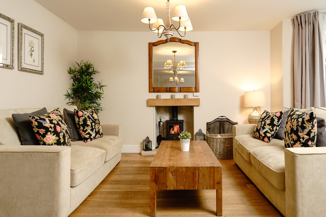 Spacious living room with log burner